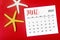The June 2023 Monthly calendar with Starfish on red background