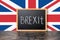 June 23: Brexit UK EU referendum concept with flag and handwriting text written in chalkboard on black