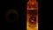 June 28th 2023, Uttarakhand, India. A creative shot of a lit up vodka bottle with a speaker in the background. Party theme