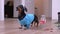 June 4 202, Rostov, Russia: Dachshund dog in tracksuit with wristbands on paws and headband on head that protects eyes