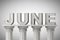 June month sign on a classic columns