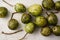 June plum, Spondias dulcis, or ambarella edible fruit on white cement plate background.