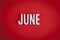 June sign lettering on red background