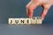 Juneteenth in June symbol. Concept words Juneteenth and June on wooden cubes. Beautiful grey table grey background. Businessman