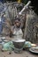 Jungle of CAR. Africa. Jungle of the Central-African Republic. Baka woman cooks food, crushing a flour in a mortar