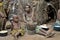 Jungle of CAR. Africa. Jungle of the Central-African Republic. Baka woman cooks food, crushing a flour in a mortar