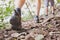 Jungle trekking, group of hikers backpackers walking together outdoors in the forest