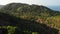 Jungles and mountains of tropical island. Drone view of green jungles and huge boulders on volcanic rocky terrain of Koh