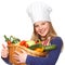 Junior cook holding a basket with vegetables