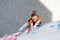 Junior female Athlete makes hard move on climbing Wall