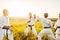 Junior karate fighters with master, skill training