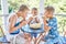 Junior school children and preschooler eating fresh melon