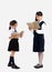 Junior school girl uniform standing and reading book full length white background