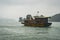 Junk Boat Floating on the water in Halong Bay, Vietnam. Tourism, activities for travelers in Asia. Vietnamese ocean