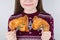 Junk food dependency concept. Cropped closeup photo of cute kid child teenager girl holding two greasy oily fatty fried portions