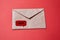 Junk mail or spam and fake letter idea. Concept for unsolicited mail or e-mail. Envelope on red background