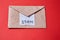 Junk mail or spam and fake letter idea. Concept for unsolicited mail or e-mail. Piece of toilet paper and envelope