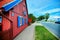 JUODKRANTE, LITHUANIA - August 18, 2019: Beautiful street with old Lithuanian traditional wooden houses. Fishermen`s village on