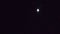Jupiter with 4 moons, rising. In dark.