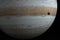 Jupiter planet and Ganymede moon in the outer space