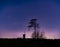 Jupiter and Saturn planets in the night sky appearing over an old Dutch windmill known as Broekmolen