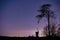 Jupiter and Saturn planets in the night sky appearing over an old Dutch windmill known as Broekmolen