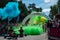 Jurmala, Kauguri, Latvia - August 14 2022: Close-up of the start of race on track with paints. Participants run in green-blue