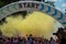 Jurmala, Kauguri, Latvia - August 14 2022: Close-up of the start of race on track with paints. Participants run in yellow cloud of