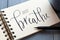 JUST BREATHE hand-lettered in notepad