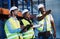 This just came in. Shot of a group of contractors standing in the warehouse and looking contemplative while having a