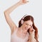 Just dancing with myself...and its great. A woman dancing while listening to her headphones.