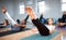 Just a few more seconds. Shot of a group of students performing crunches during a pilates class.