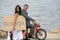 Just Married - bride and groom on aged motorcycle