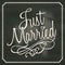 Just Married lettering sign on chalkboard background