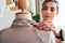 It just needs a few adjustments. a young fashion designer working on a garment hanging over a mannequin.