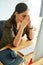 This is just not my day. a young businesswoman looking stressed out in an office.