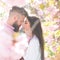 Just one kiss. Bearded man hug sensual woman. Couple in love among blossoming trees. Valentines day concept. Desire and