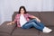 Just relaxing here. Feel comfortable on this couch. Kid girl with long hair relaxing. Favorite place for relaxing at