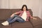 Just relaxing here. Feel comfortable on this couch. Kid girl with long hair relaxing. Favorite place for relaxing at