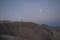 Just before sunrise, man climbs a mountain to meet the sunrise