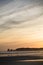 Just before sunrise silhouette of deux jumeaux in summer sky on a sandy beach