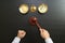 justice and law concept.Top view of Male judge hand in a courtroom with the gavel and brass scale on dark wood table