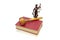 Justice statue, book and judges gavel on a white background.