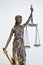 Justitia figure with blindfold, sword and balance
