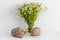 Jute product and a ball of thread against the background of daisies