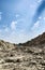 A kaccha valley road of rocky soil in the summer heat