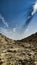 A kaccha valley road of rocky soil in the summer heat