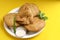 Kachori and potato samosa with green chilly in plate. famous spicy snack in india