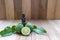 Kaffir lime or bergamot essential oil bottle with fresh bergamot and leaves