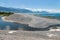 Kaikoura coastline with stream and pebble beach, South Island, New Zealand